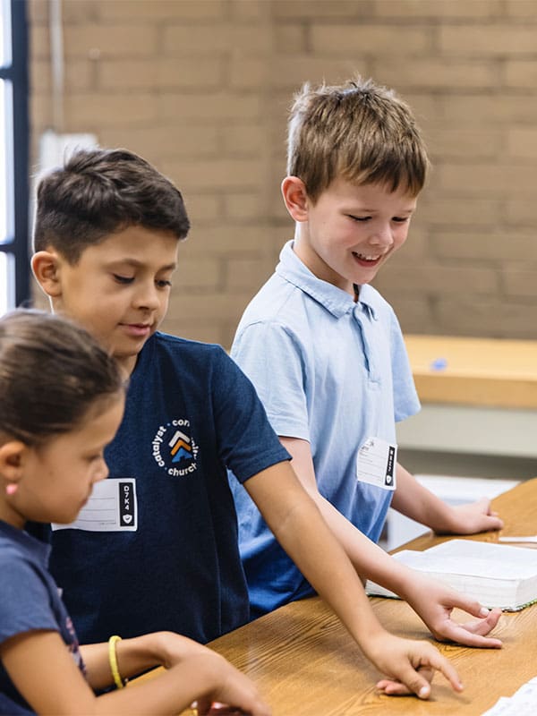 kids reading at table